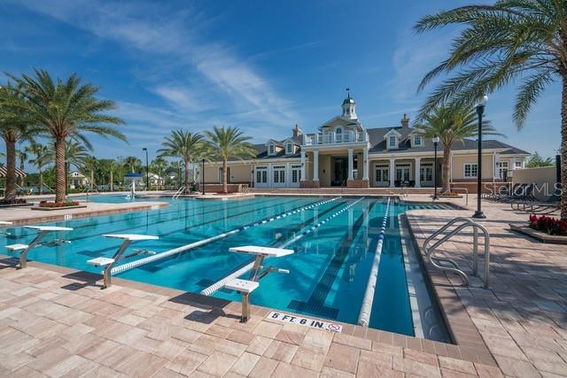 pool featuring a patio area, french doors, and a diving board