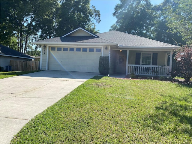 ranch-style home featuring fence, covered porch, concrete driveway, a front yard, and a garage