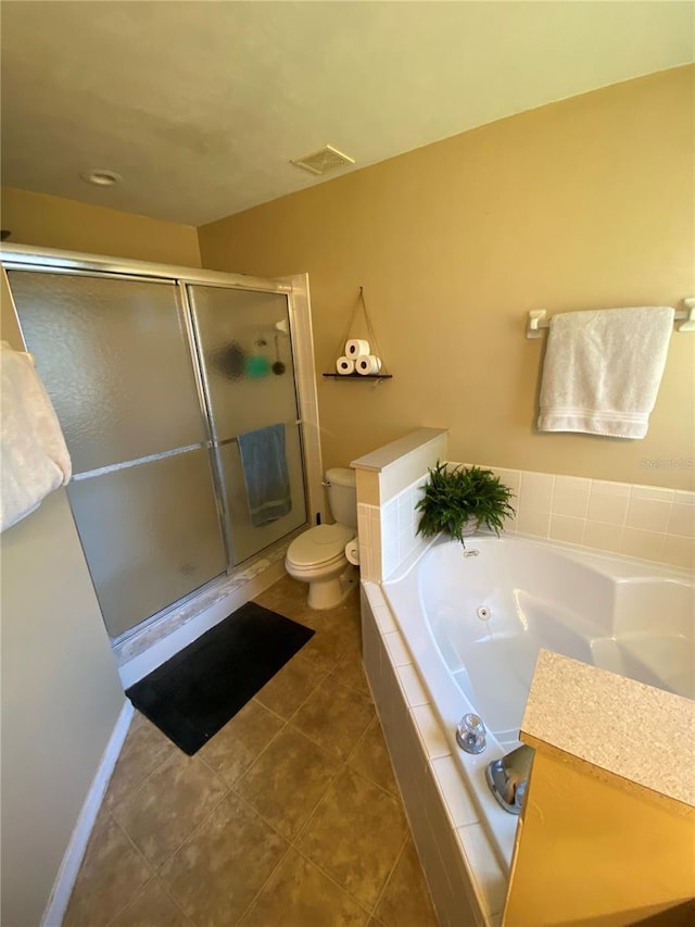 bathroom with visible vents, a garden tub, toilet, a stall shower, and tile patterned flooring