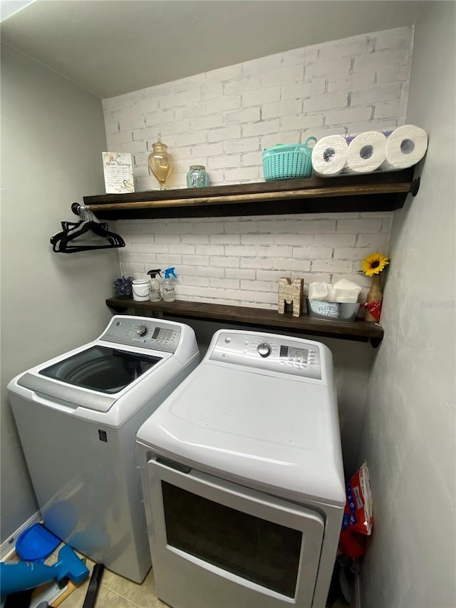 laundry room with washer and dryer and laundry area