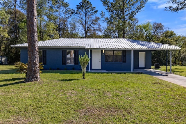 single story home with a carport, a front yard, and metal roof