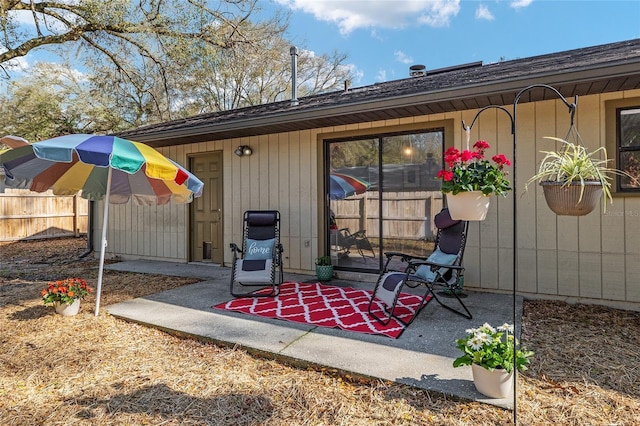 view of patio featuring fence