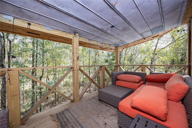 wooden deck with a forest view