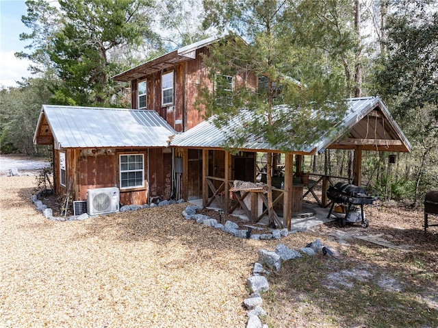 chalet / cabin with ac unit and metal roof