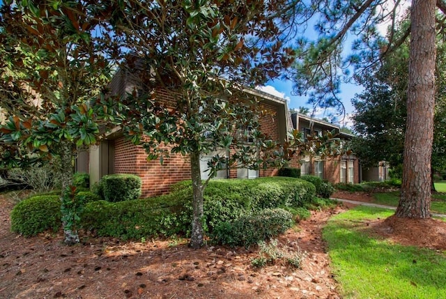 view of property exterior featuring brick siding