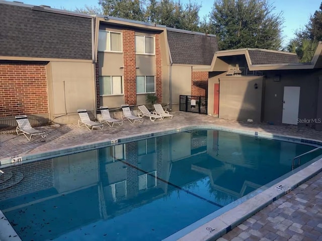 community pool featuring a patio area