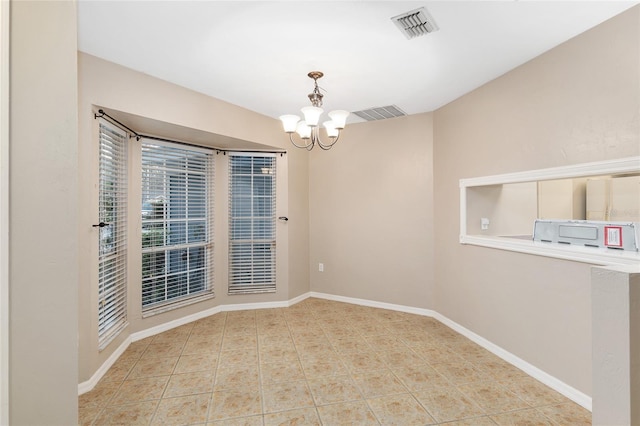 unfurnished room featuring tile patterned floors, visible vents, baseboards, and an inviting chandelier