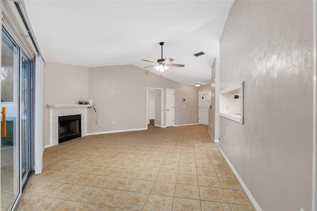 unfurnished living room with visible vents, baseboards, vaulted ceiling, a fireplace, and a ceiling fan