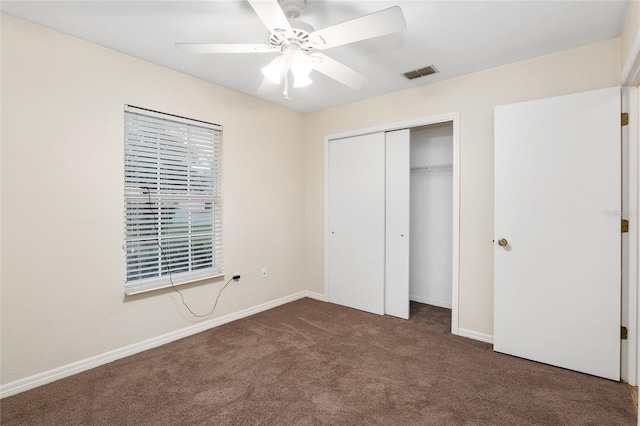 unfurnished bedroom with a closet, visible vents, baseboards, and carpet