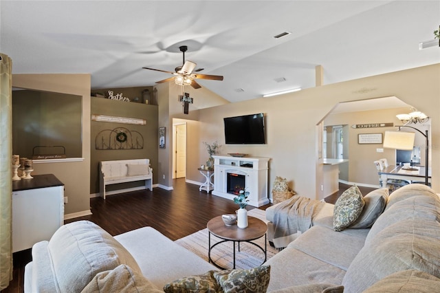 1762 NE 39th St, Ocala, FL 34479 - living area featuring lofted ceiling, visible vents, wood finished floors, a warm lit fireplace, and ceiling fan with notable chandelier