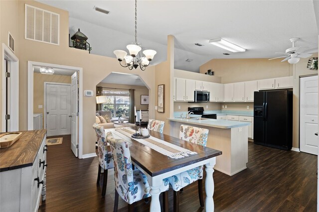 1762 NE 39th St, Ocala, FL 34479 - kitchen featuring arched walkways, a peninsula, a sink, visible vents, and black appliances
