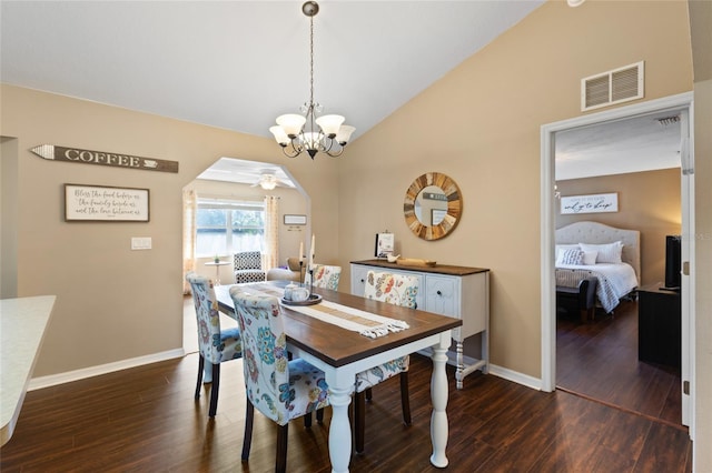 1762 NE 39th St, Ocala, FL 34479 - dining area featuring arched walkways, dark wood-style flooring, visible vents, baseboards, and vaulted ceiling