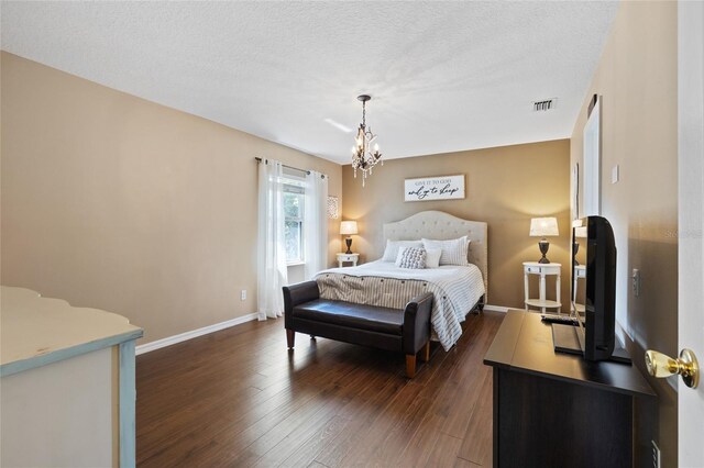 1762 NE 39th St, Ocala, FL 34479 - bedroom with dark wood-style floors, baseboards, visible vents, and a textured ceiling