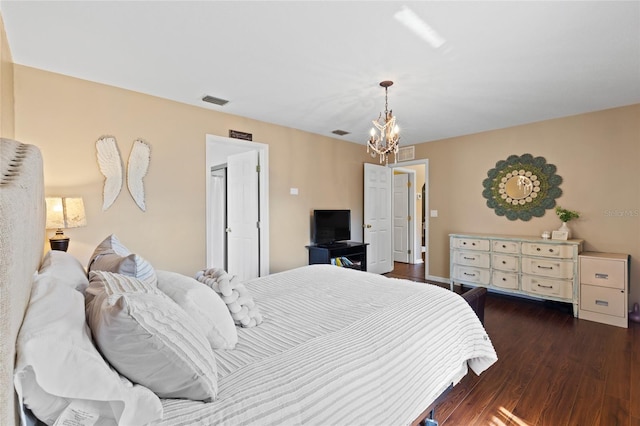 1762 NE 39th St, Ocala, FL 34479 - bedroom featuring visible vents, a notable chandelier, and wood finished floors