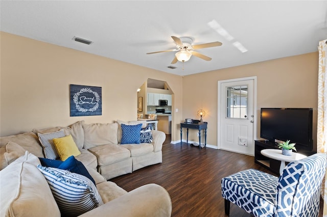 1762 NE 39th St, Ocala, FL 34479 - living room with ceiling fan, dark wood finished floors, visible vents, and baseboards