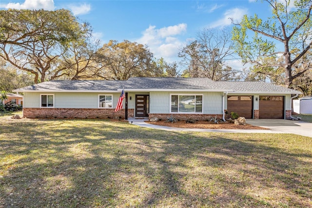 ranch-style home with brick siding, a chimney, an attached garage, driveway, and a front lawn