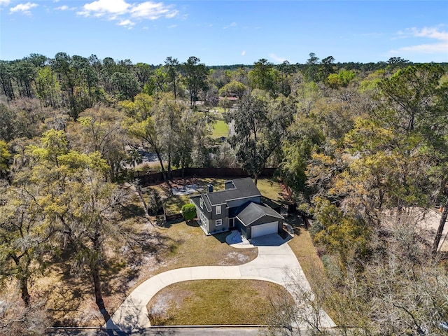 aerial view featuring a wooded view