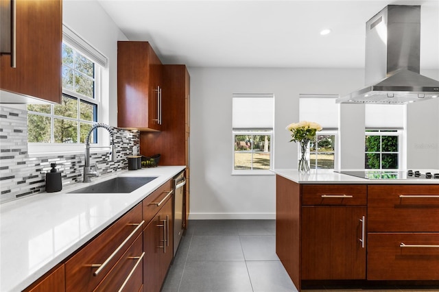 kitchen with black electric stovetop, a sink, ventilation hood, and modern cabinets