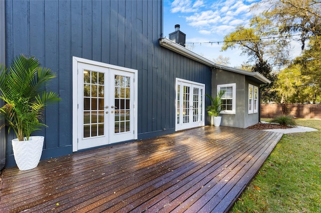 wooden deck featuring french doors and fence