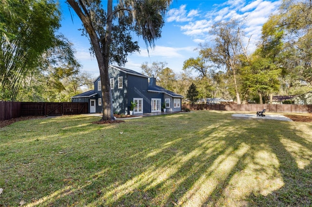 view of yard with a fenced backyard