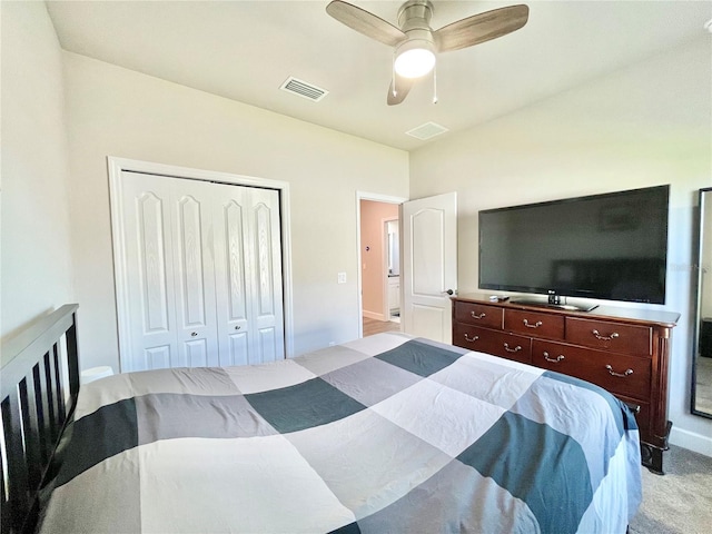 bedroom with light carpet, a closet, visible vents, and a ceiling fan