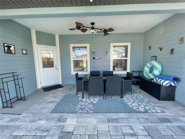 view of patio featuring ceiling fan and outdoor dining space