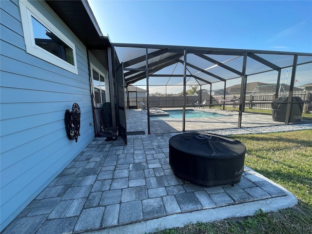 view of patio featuring an outdoor pool, glass enclosure, fence, and grilling area