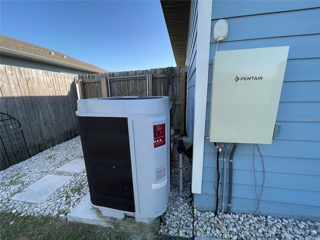 exterior details with fence and cooling unit