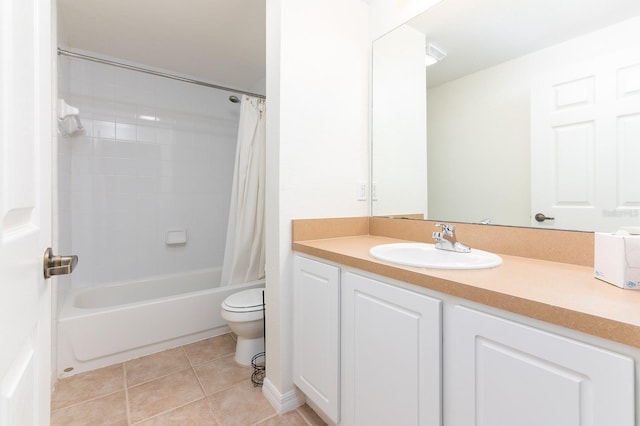 full bath with toilet, shower / bath combo, vanity, and tile patterned floors