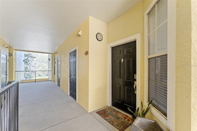 property entrance featuring stucco siding