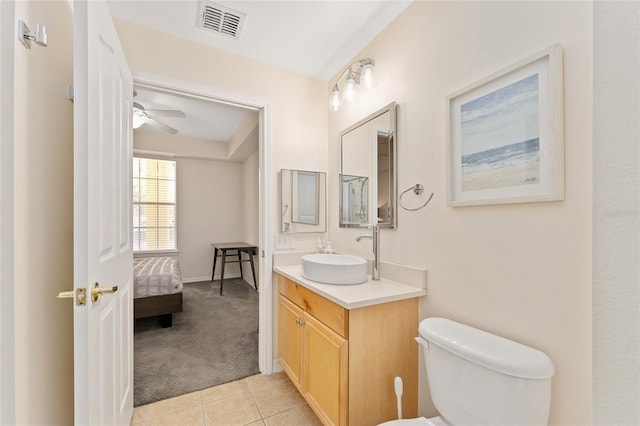 bathroom featuring vanity, visible vents, ceiling fan, tile patterned flooring, and toilet