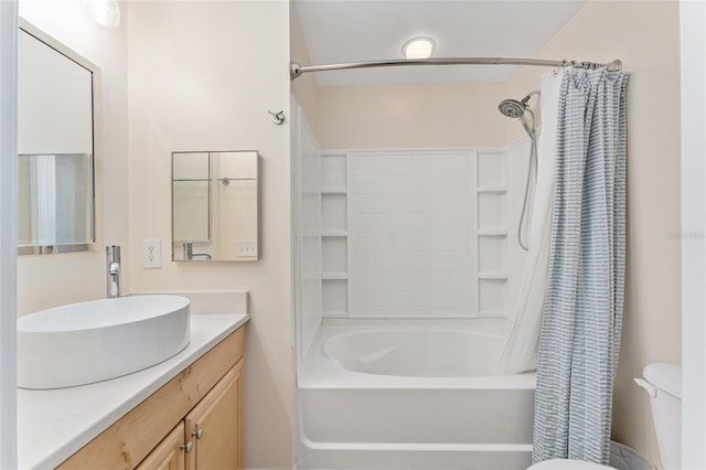 full bathroom with vanity, toilet, and shower / tub combo with curtain