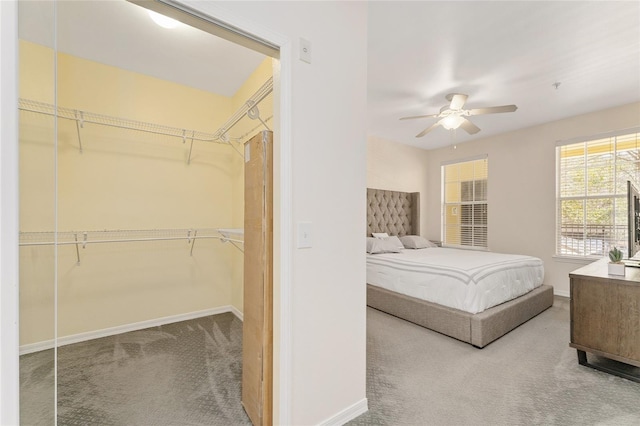 bedroom featuring a closet, baseboards, carpet, and ceiling fan