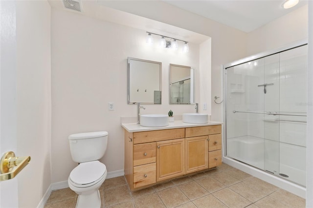 bathroom featuring a sink, visible vents, and tile patterned flooring