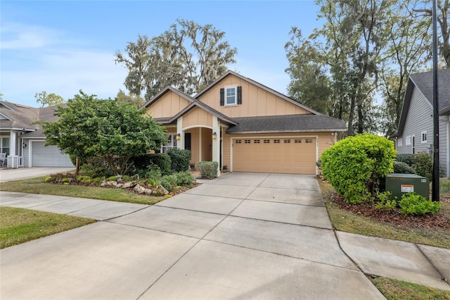 craftsman-style home featuring board and batten siding, concrete driveway, and a garage