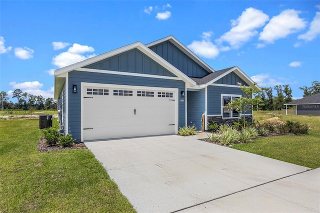 view of front of house featuring a garage, concrete driveway, central air condition unit, a front lawn, and board and batten siding