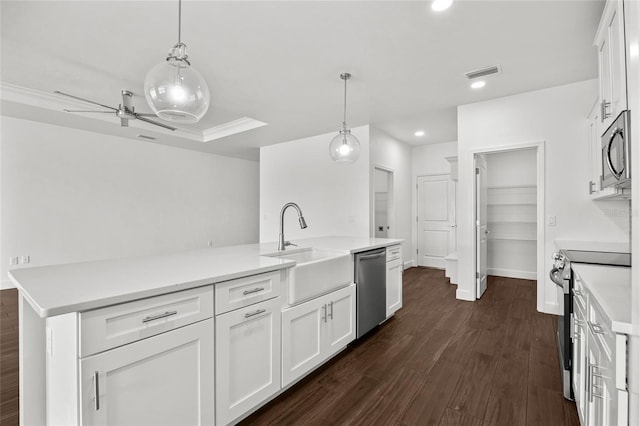 kitchen featuring stainless steel appliances, visible vents, white cabinets, light countertops, and dark wood-style floors