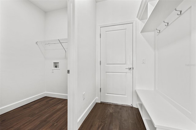 mudroom with dark wood-type flooring and baseboards