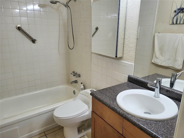 full bath with tile walls, toilet, washtub / shower combination, vanity, and tile patterned flooring