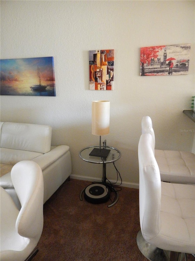 sitting room with carpet and baseboards