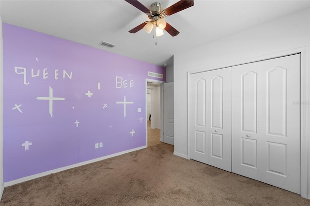 unfurnished bedroom with baseboards, a closet, visible vents, and carpet flooring