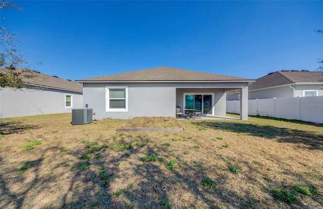 rear view of property with a patio, fence, cooling unit, a yard, and stucco siding