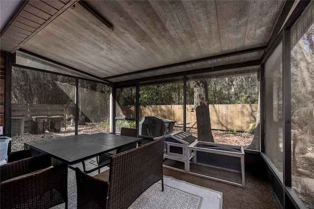 sunroom with outdoor dining space