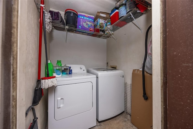 laundry room with separate washer and dryer and laundry area