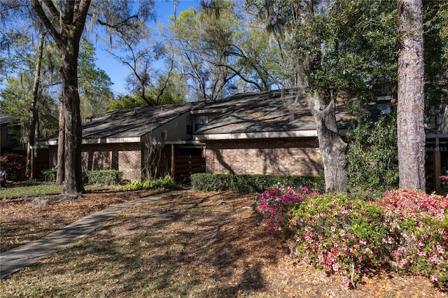 view of front of home with brick siding