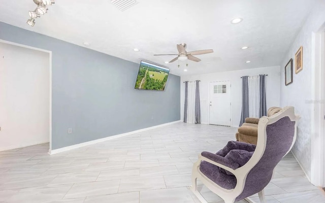 living area with recessed lighting, visible vents, baseboards, and a ceiling fan