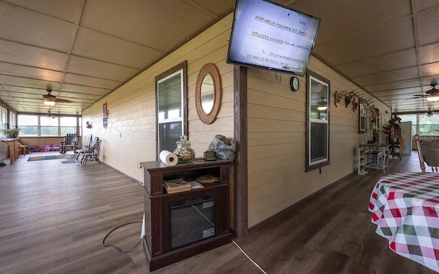 wooden terrace with covered porch and ceiling fan