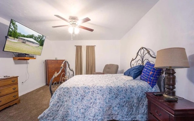 bedroom with dark colored carpet, baseboards, and a ceiling fan