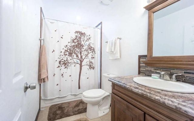 bathroom featuring tasteful backsplash, tile patterned floors, toilet, and vanity