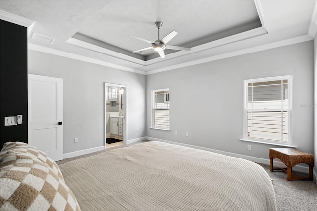 bedroom featuring ornamental molding, a raised ceiling, light colored carpet, and baseboards